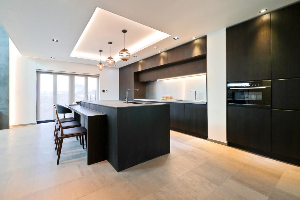 Deep Blue electrician installing LED downlights in a Queensland home