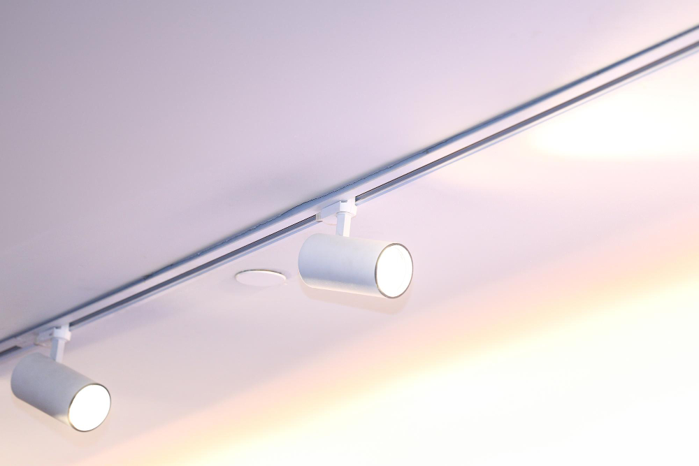 Adjustable LED spotlights highlighting a feature wall in a modern living room